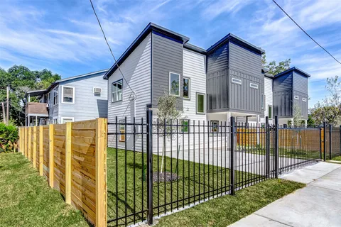 a view of a house with a iron gate