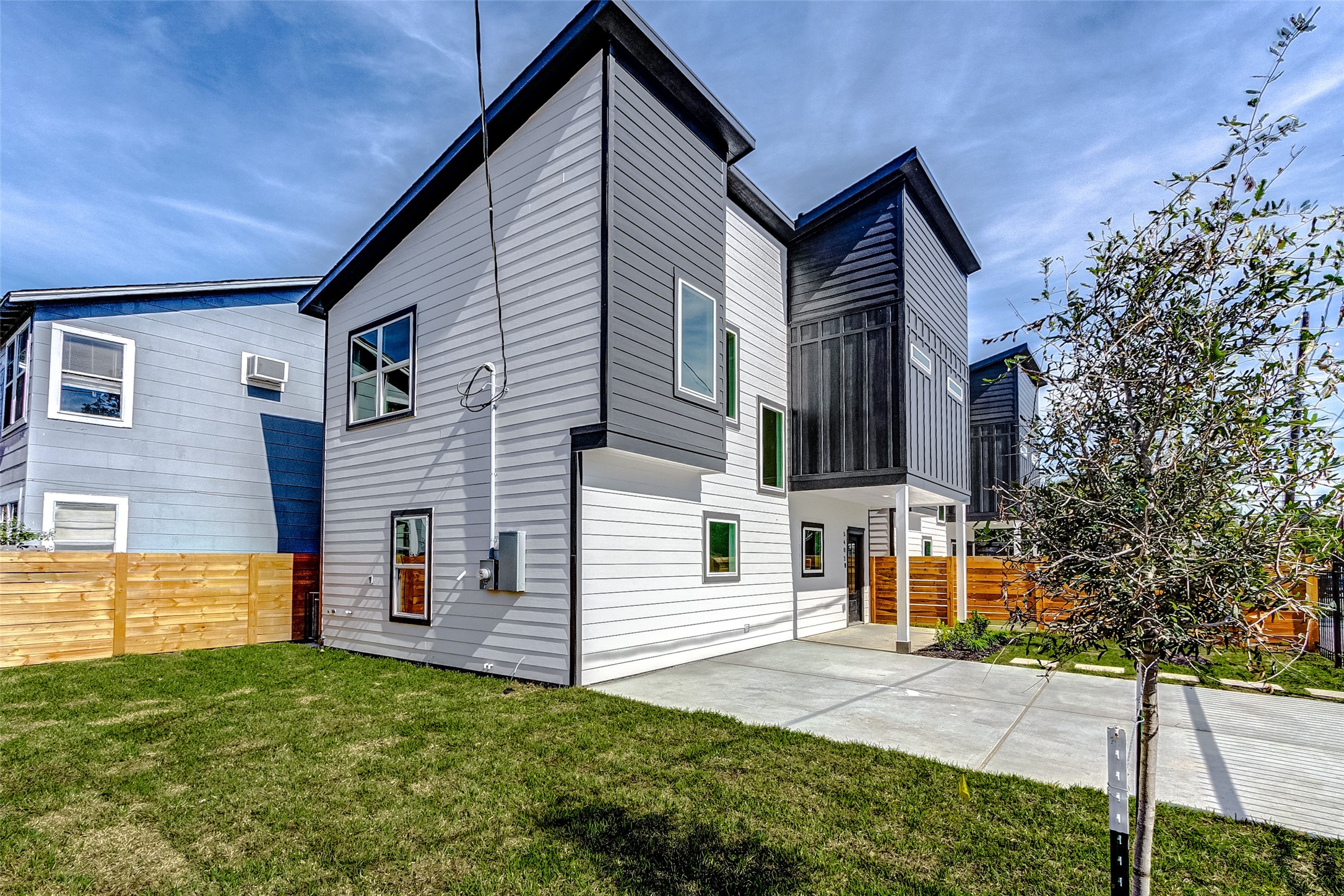5407 Lee Street Houston, TX 77020 - Photo 2 of 36 a front view of a house with a yard and garage