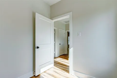 a view of a bathroom from a hallway
