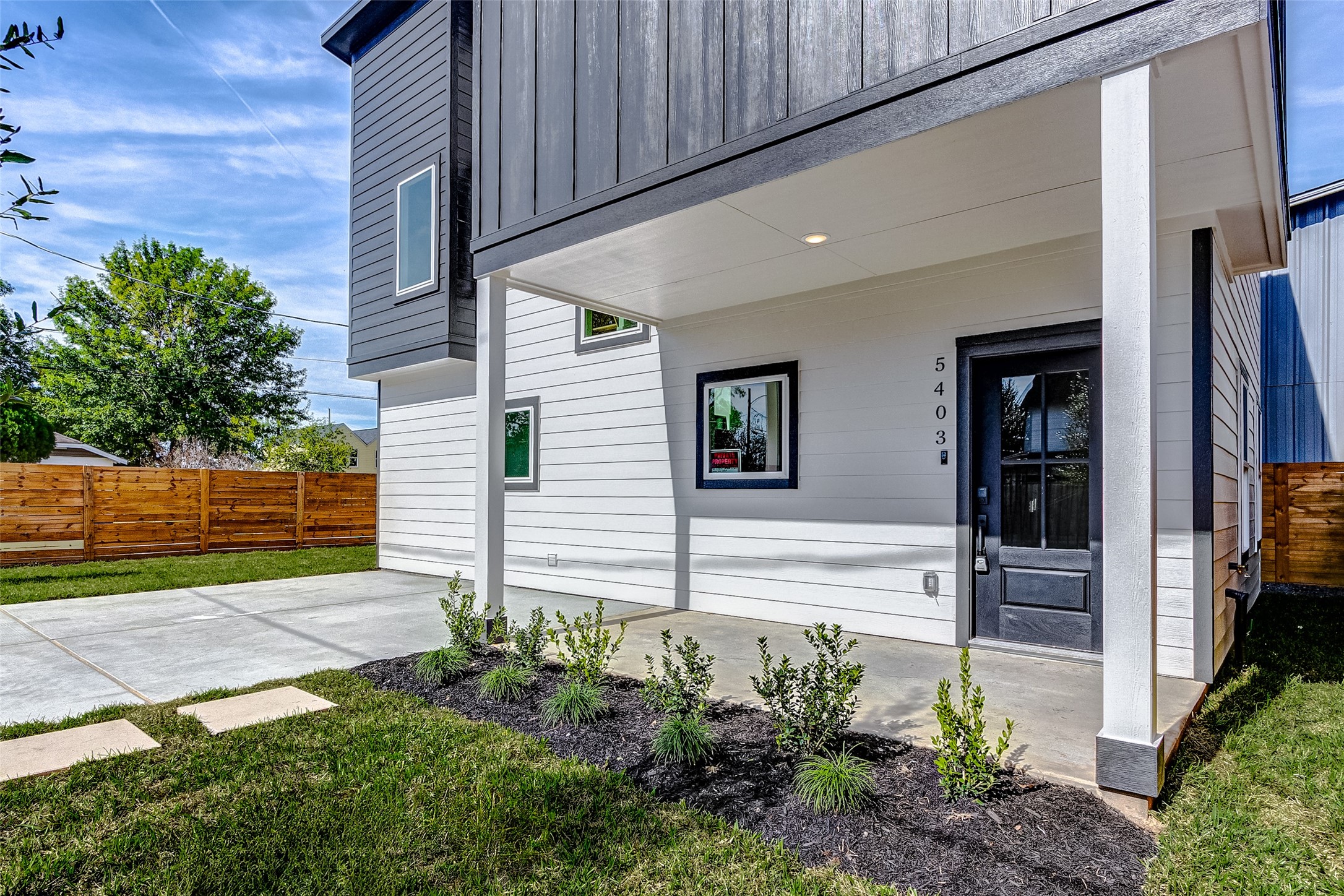5407 Lee Street Houston, TX 77020 - Photo 4 of 36 a view of a pathway of house with flower plants
