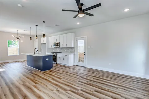 a view of kitchen with wooden floor
