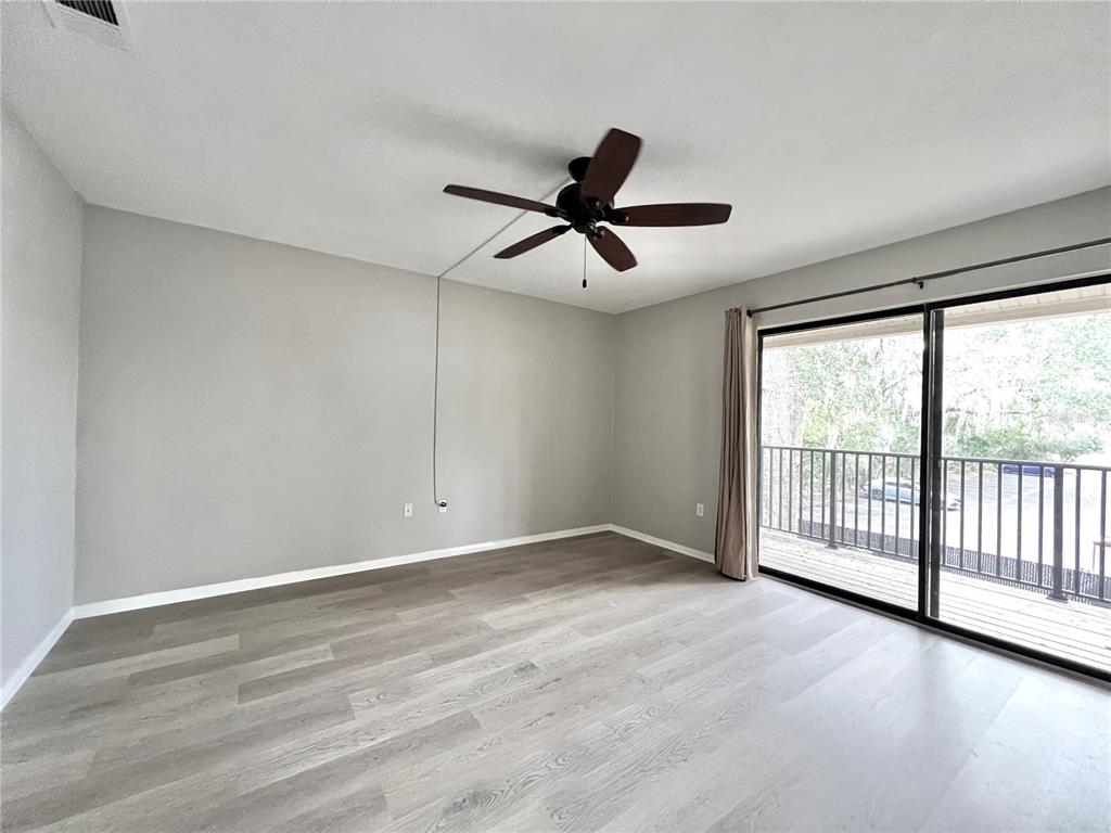 507 Northwest 39th Road, Unit 312 Gainesville, FL 32607 - Photo 14 of 34 a view of an empty room with a window