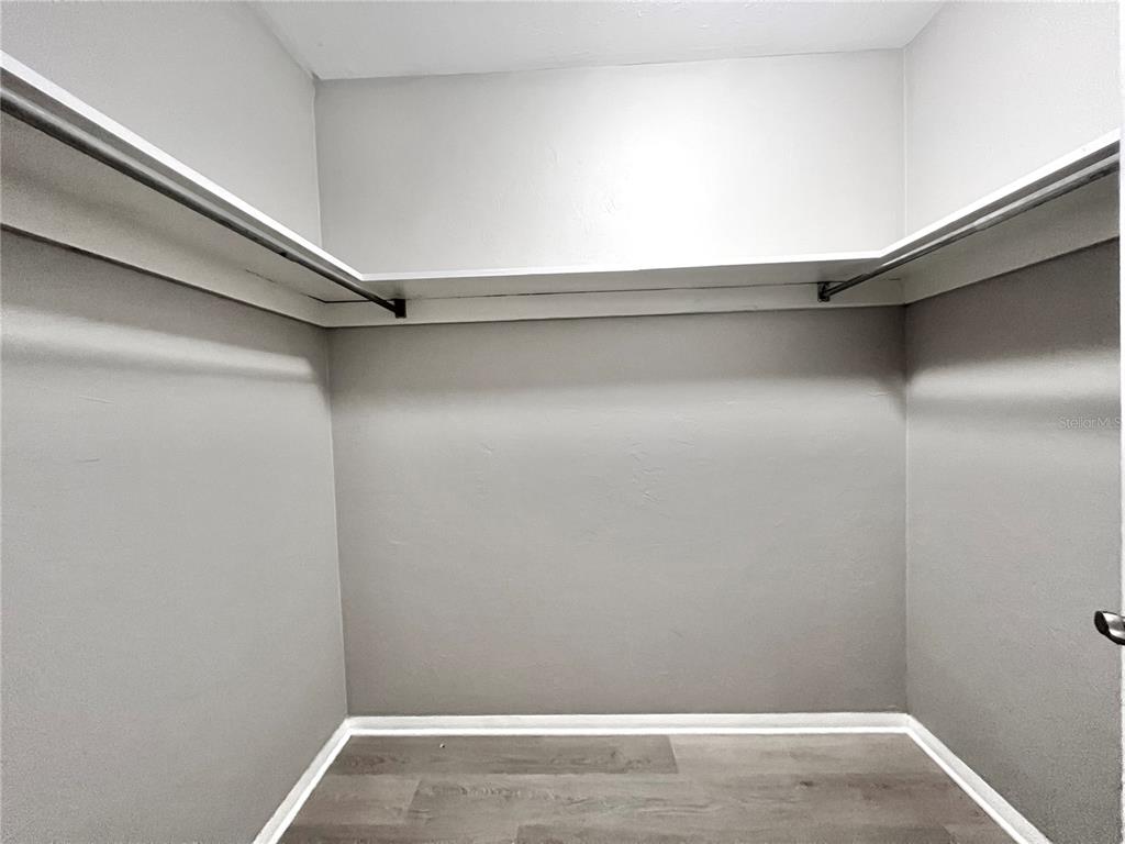 507 Northwest 39th Road, Unit 312 Gainesville, FL 32607 - Photo 18 of 34 a view of a room with shelf on the wall