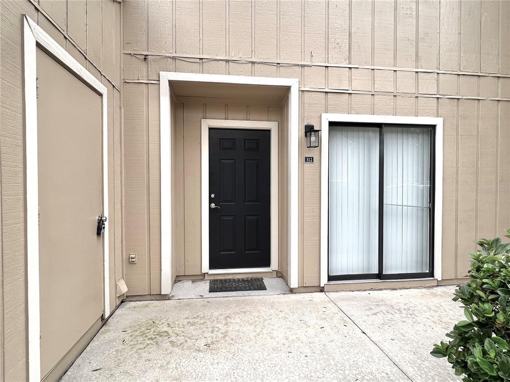 507 Northwest 39th Road, Unit 312 Gainesville, FL 32607 - Photo 2 of 34 a view of garage with a white door
