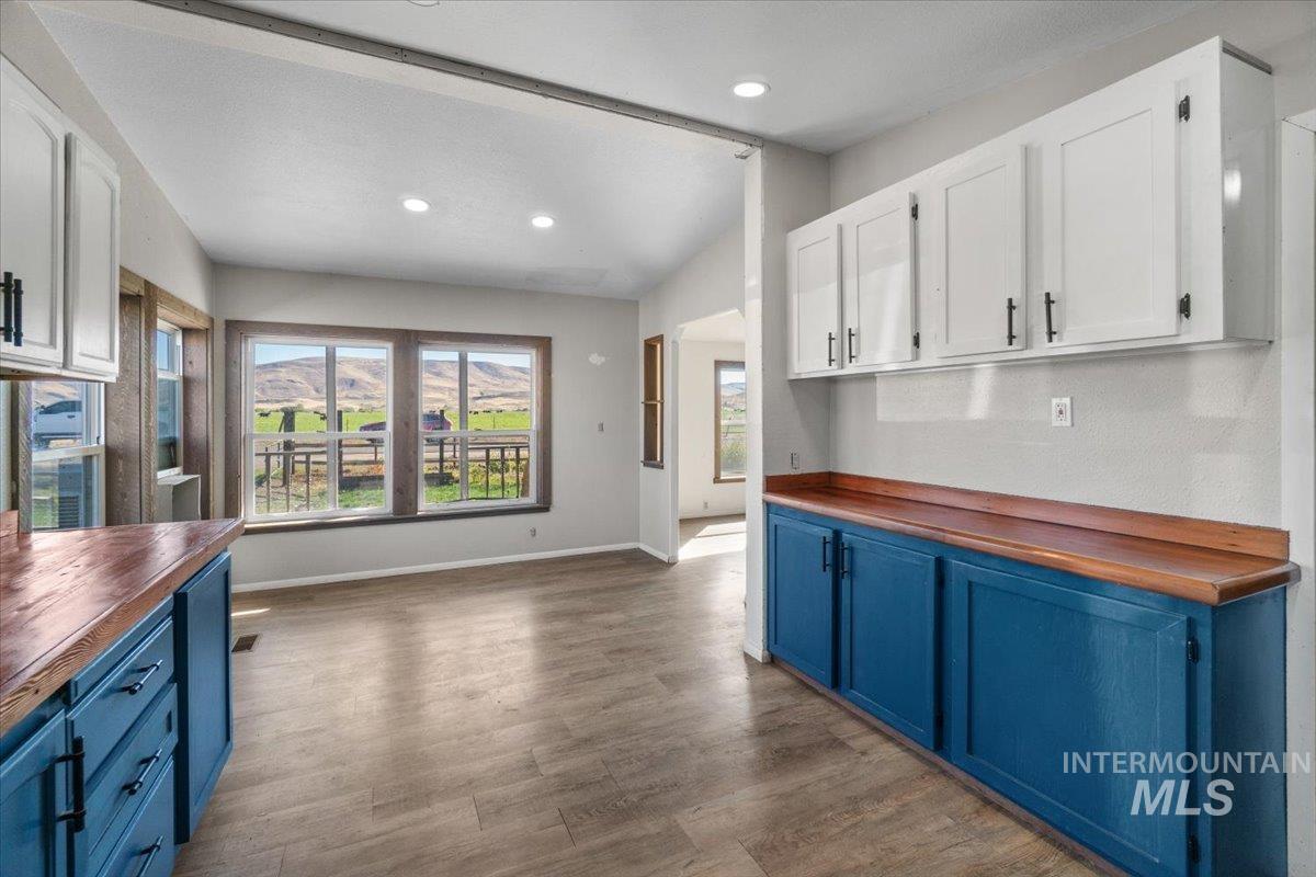 2284 Weiser River Road Weiser, ID 83672 - Photo 17 of 43 Kitchen with wood counters, blue cabinets, dark wood-style flooring, and recessed lighting