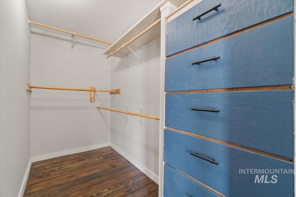 2284 Weiser River Road Weiser, ID 83672 - Photo 22 of 43 Spacious closet with dark wood-style floors