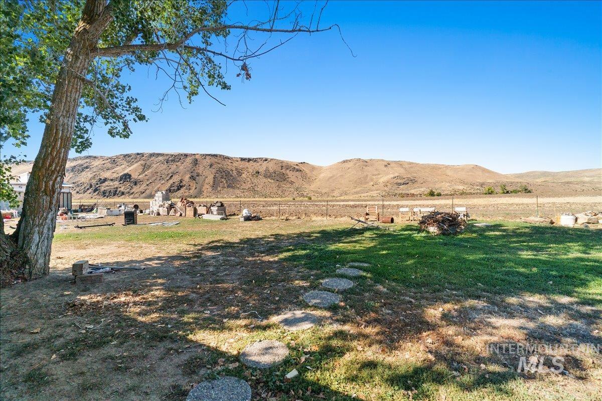 2284 Weiser River Road Weiser, ID 83672 - Photo 28 of 43 View of green lawn featuring a mountain view and a rural view