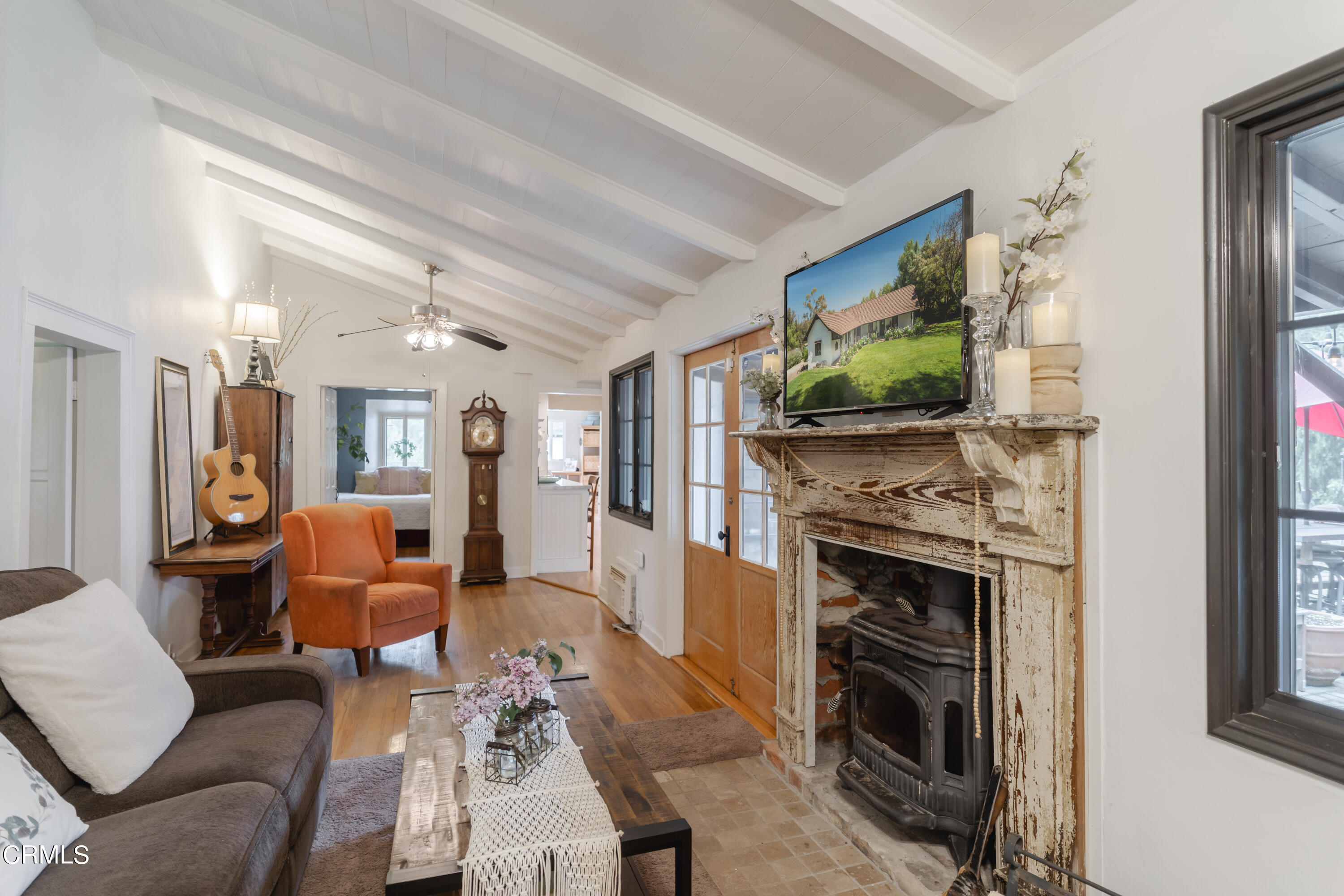 919 Puddingstone Drive La Verne, CA 91750 - Photo 16 of 42 a living room with furniture a flat screen tv and a fireplace
