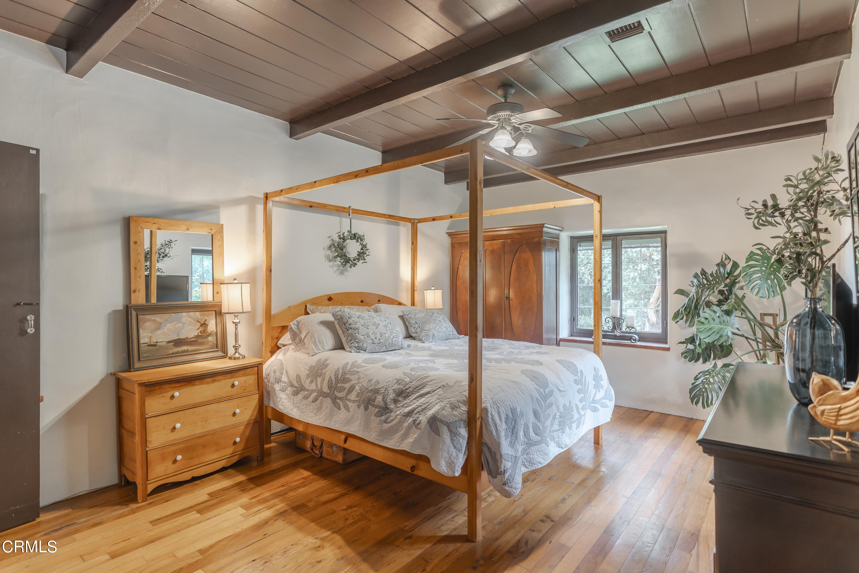 919 Puddingstone Drive La Verne, CA 91750 - Photo 23 of 42 a bedroom with a large bed and wooden floor