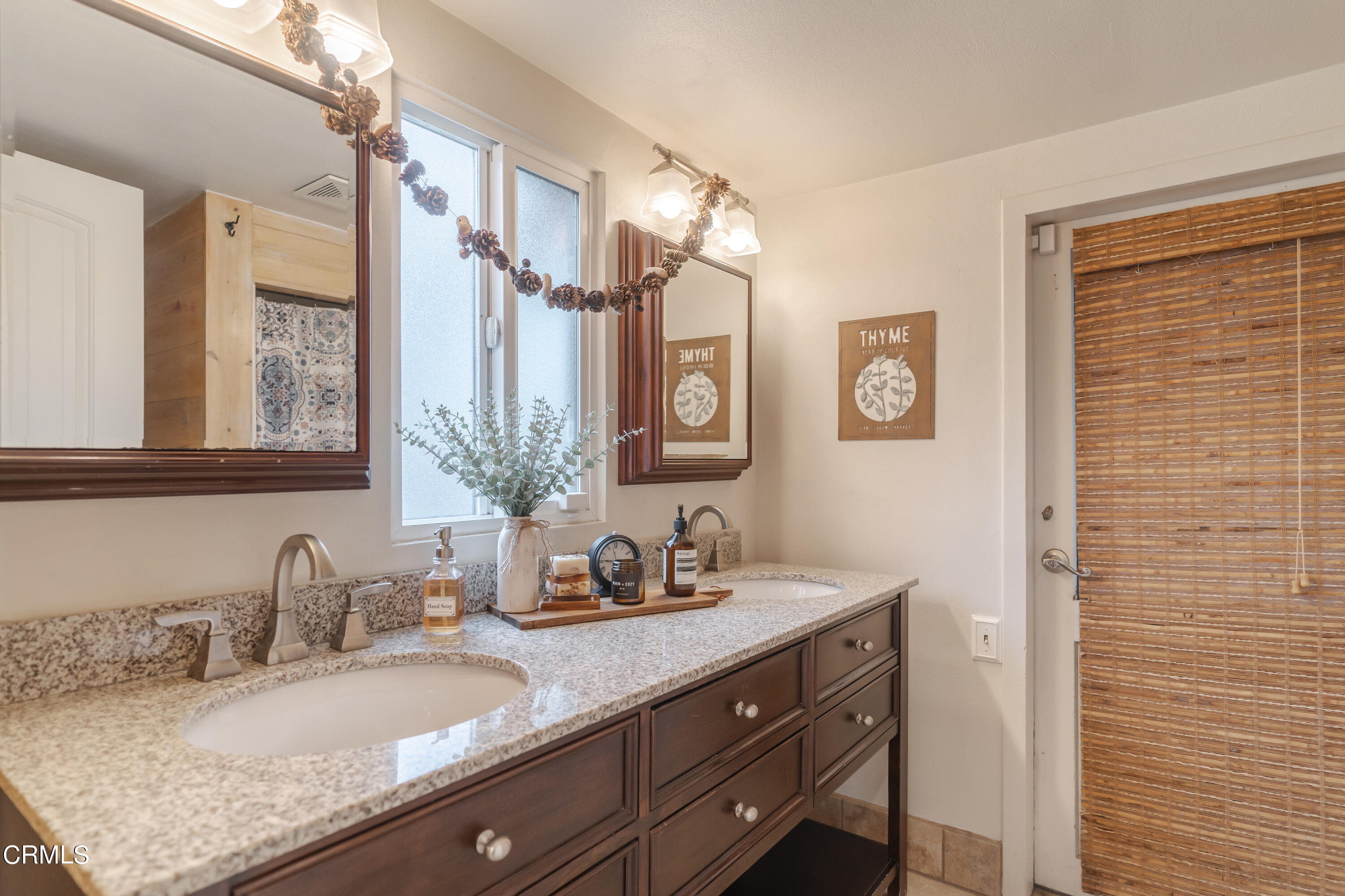919 Puddingstone Drive La Verne, CA 91750 - Photo 31 of 42 a bathroom with a granite countertop sink and a mirror