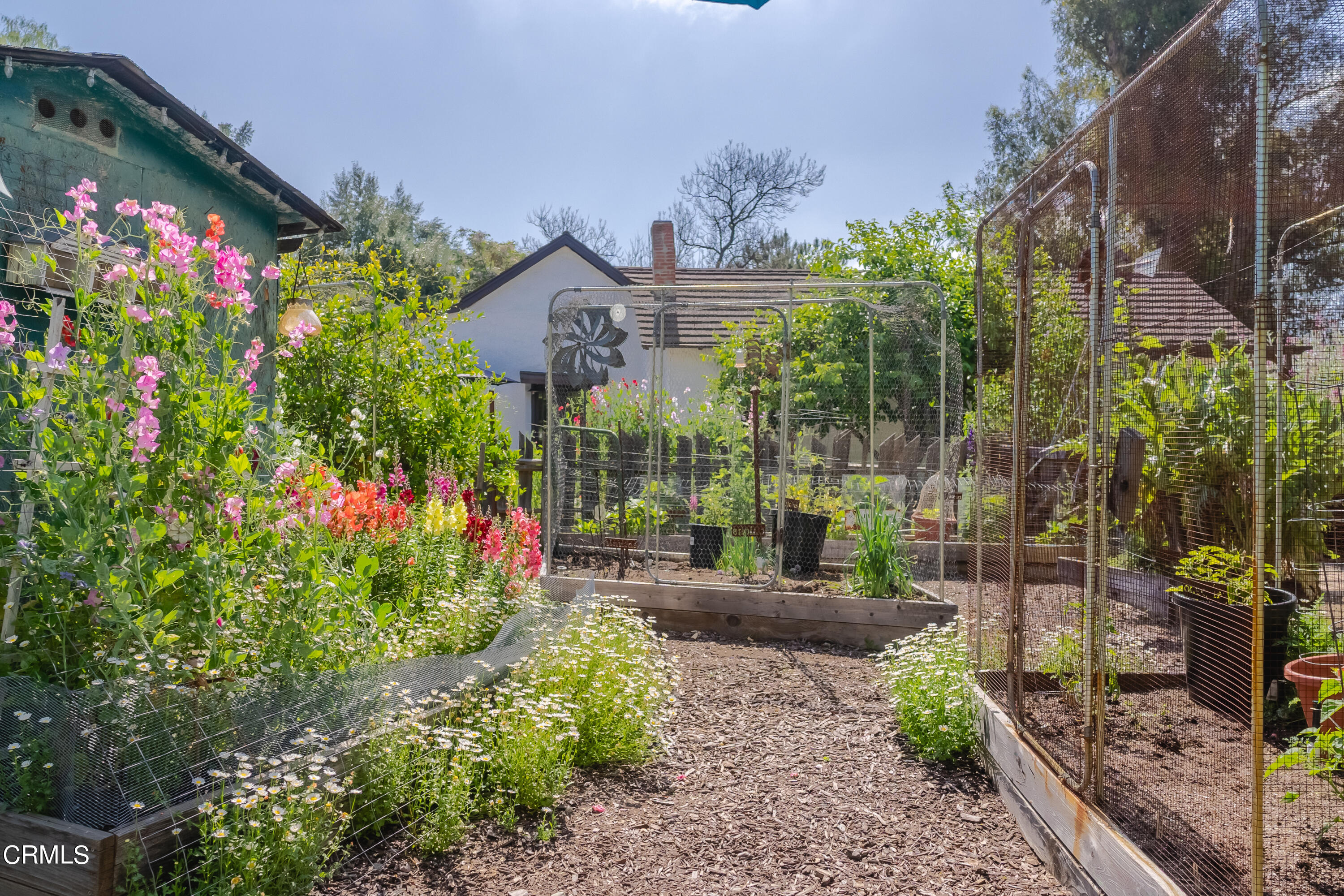 919 Puddingstone Drive La Verne, CA 91750 - Photo 35 of 42 a front view of a house with a yard and fountain