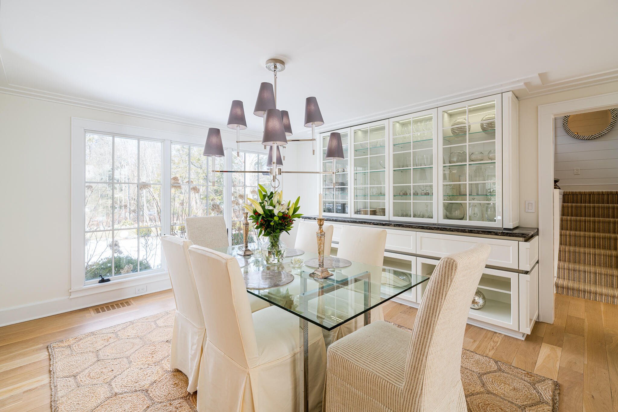65 Mill Road New Canaan, CT 06840 - Photo 13 of 42 a view of a dining room with furniture and a window