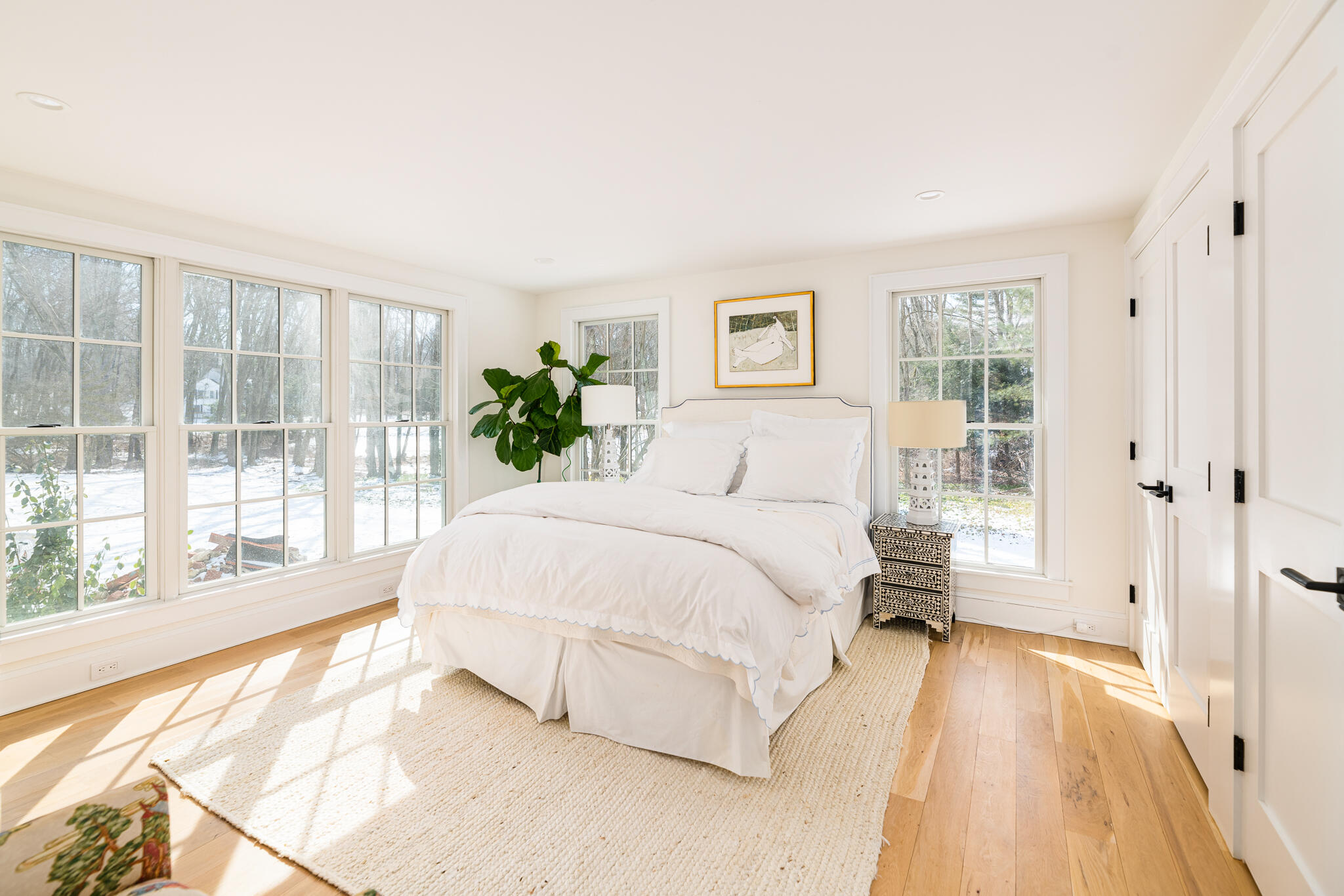 65 Mill Road New Canaan, CT 06840 - Photo 25 of 42 a bedroom with a bed and a large window