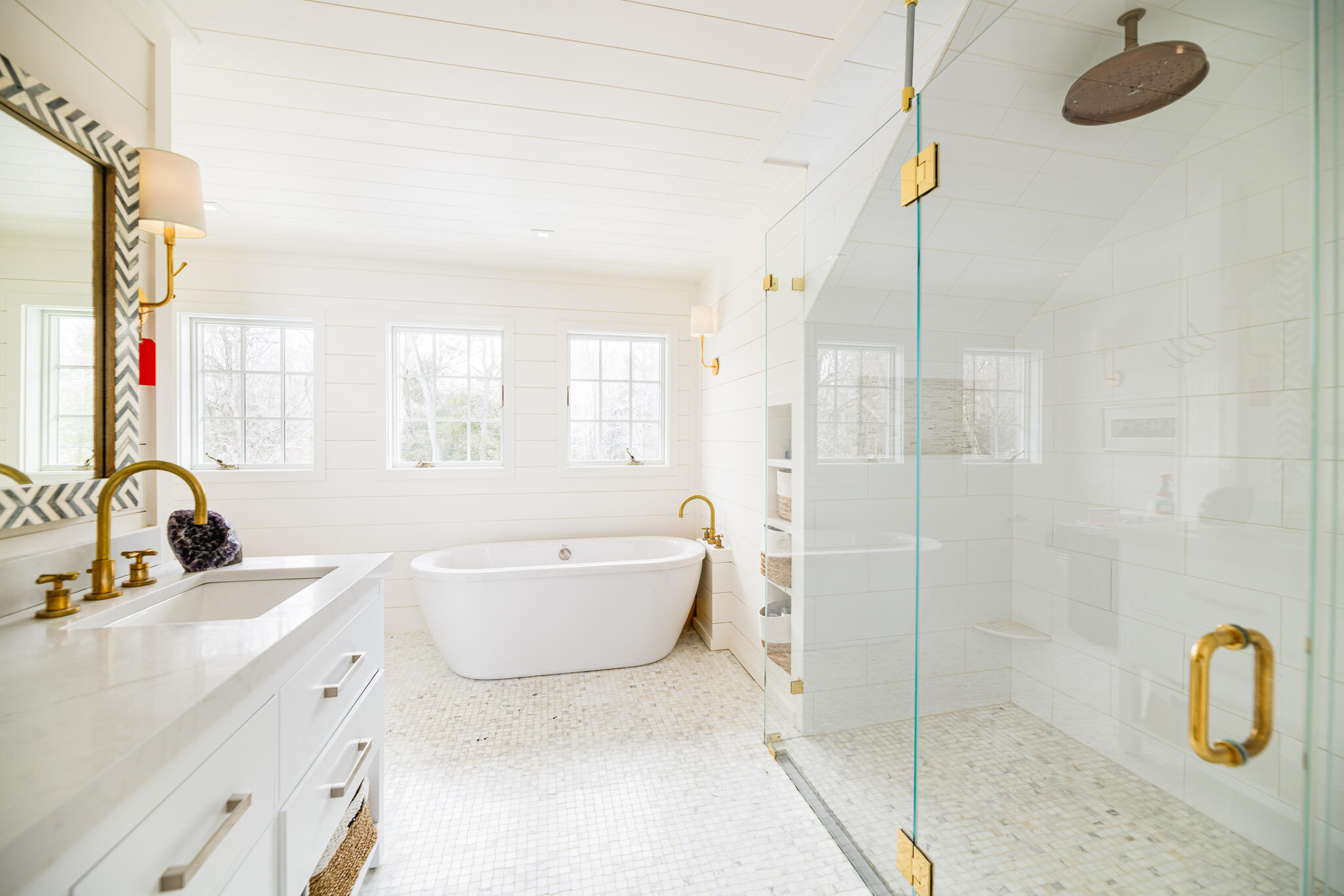 65 Mill Road New Canaan, CT 06840 - Photo 31 of 42 a bathroom with a sink and mirror with bathtub