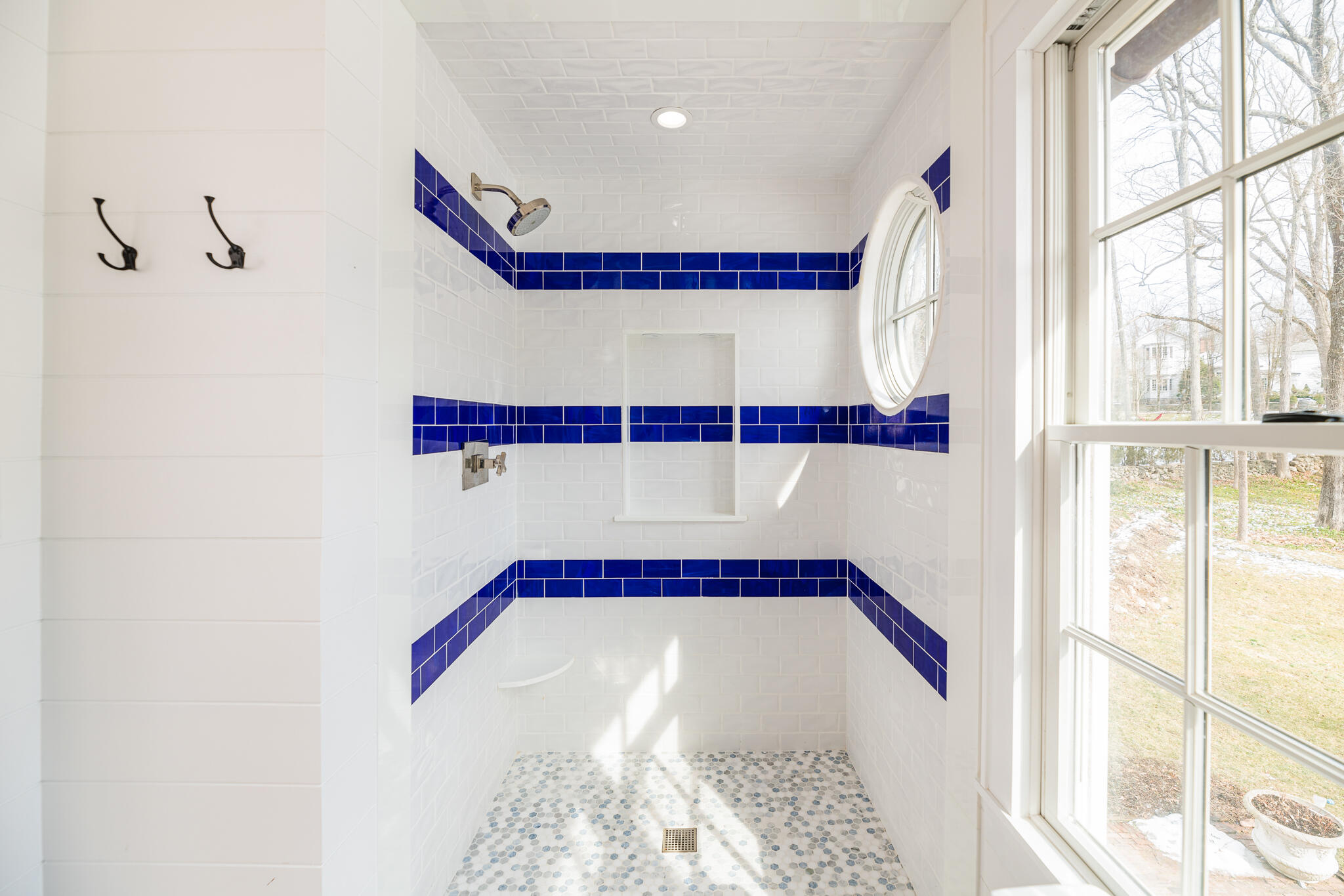 65 Mill Road New Canaan, CT 06840 - Photo 36 of 42 a bathroom with a bathtub and a window