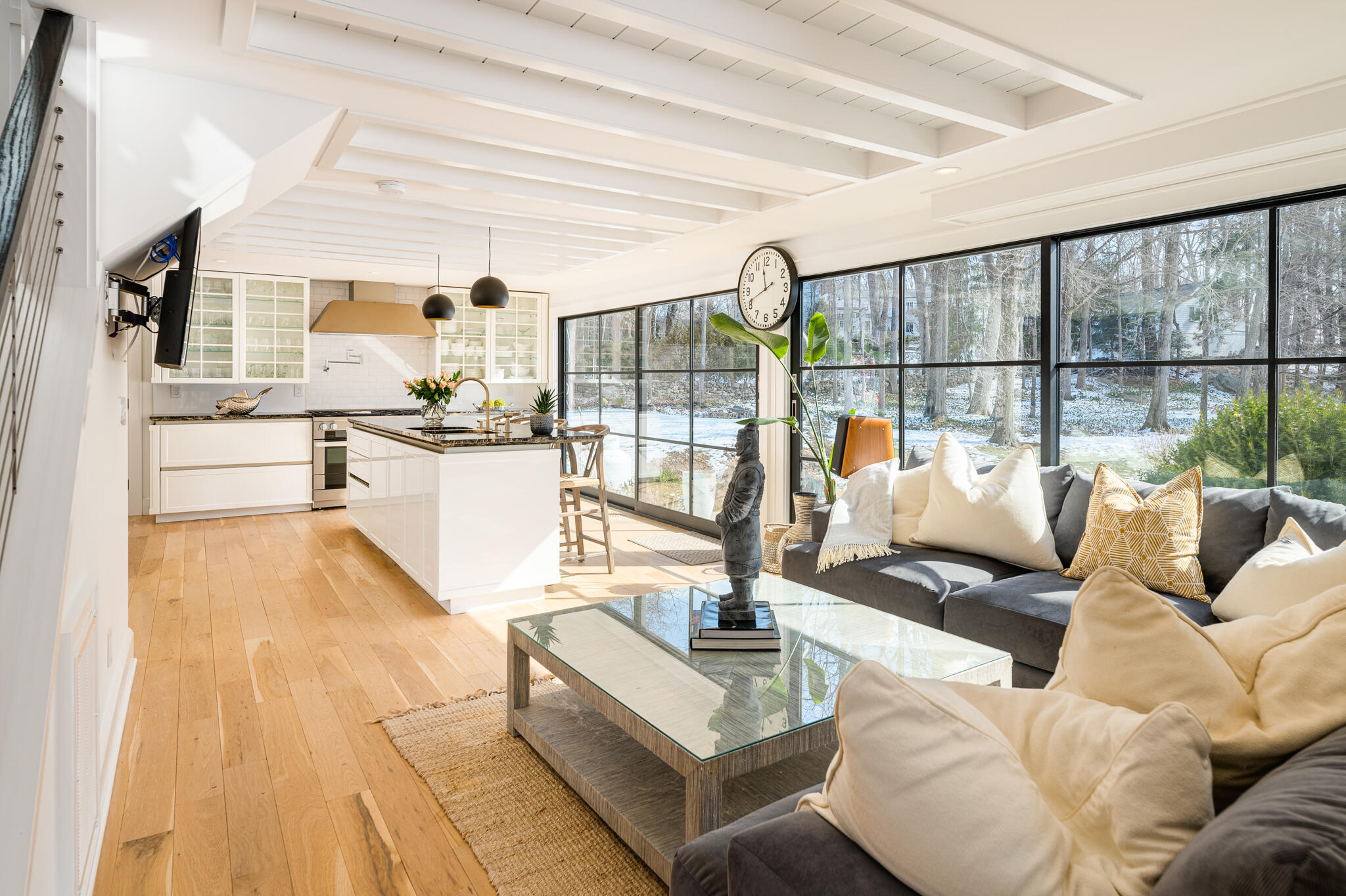65 Mill Road New Canaan, CT 06840 - Photo 6 of 42 a living room with furniture large windows and view of kitchen