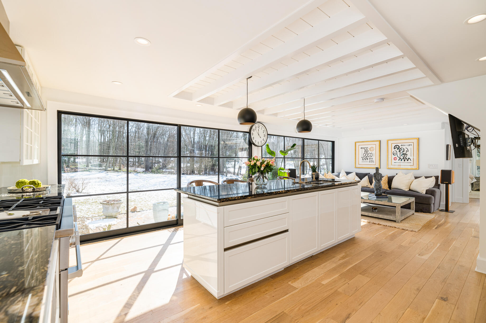 65 Mill Road New Canaan, CT 06840 - Photo 7 of 42 a living room with stainless steel appliances kitchen island granite countertop furniture and a large window