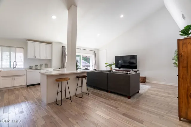 a balcony with tall trees in front of it