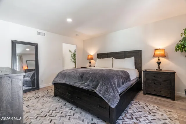 a bathroom with a sink a mirror and shower