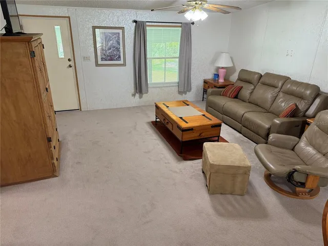 a bedroom with furniture and a chair