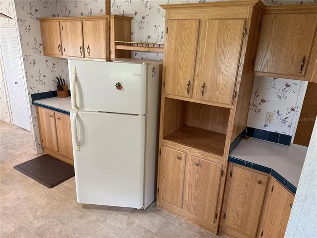 a bedroom with a bed and a mirror