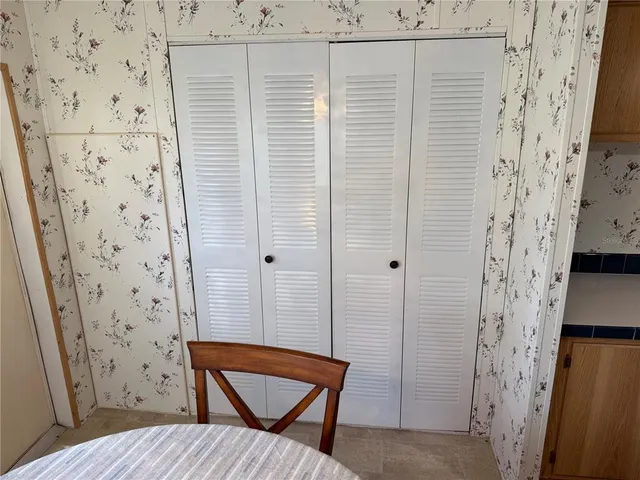 a bath tub sitting next to a blue sink and a toilet