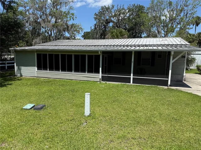 a backyard of a house with lots of green space