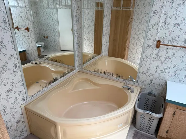 a backyard of a house with yard and trampoline