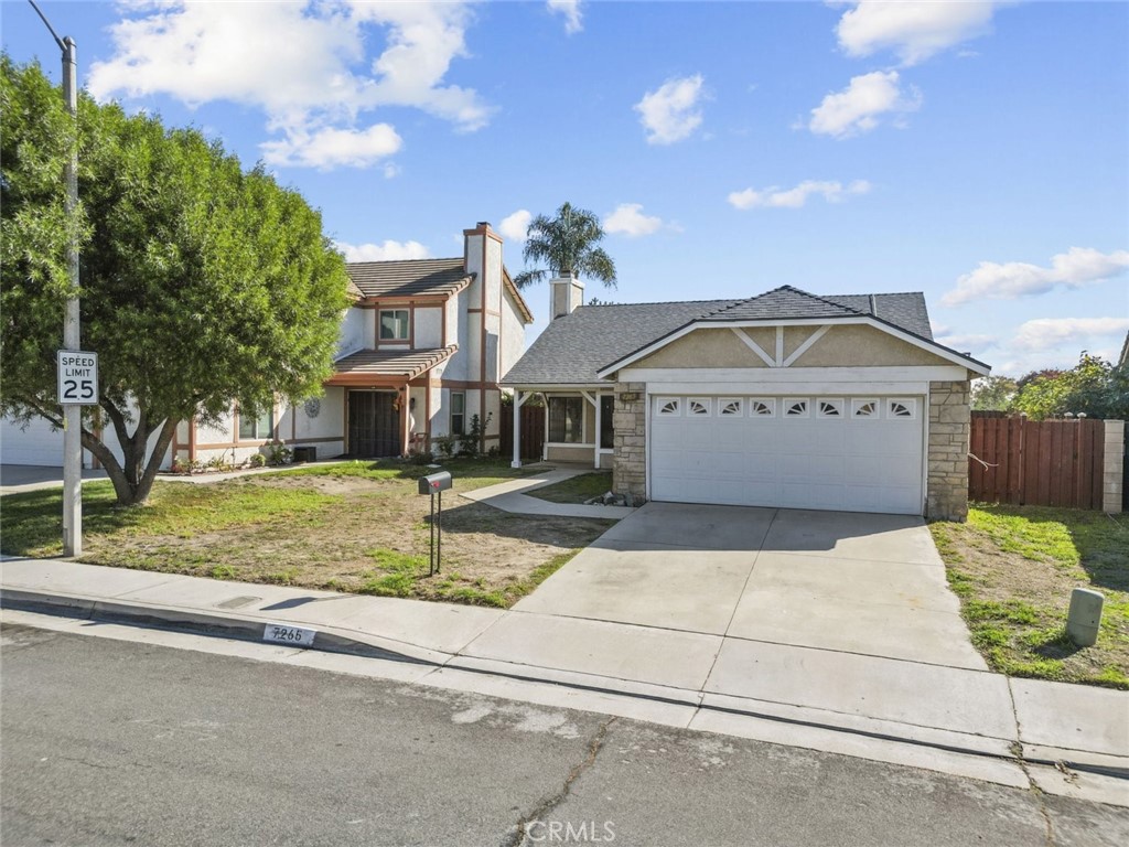 7265 Parkside Place Rancho Cucamonga, CA 91701 - Photo 1 of 1 a front view of a house with garden