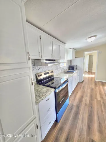 a bedroom with a bed and a table