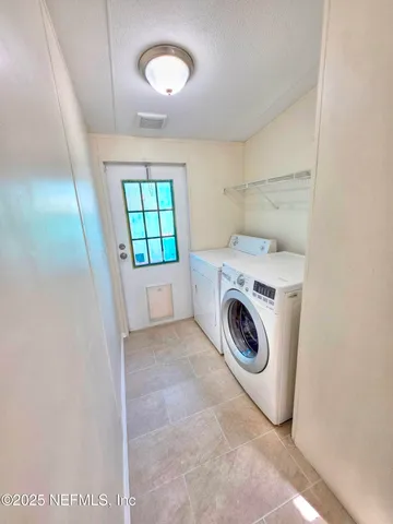 a view of a room with wooden floor and staircase