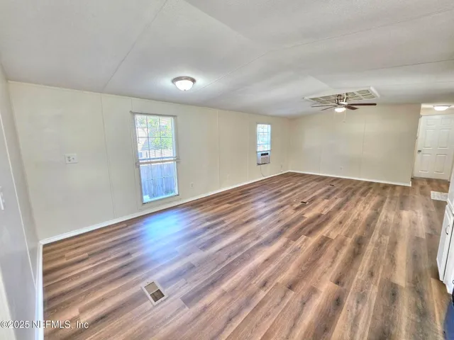 a view of a swimming pool with a yard