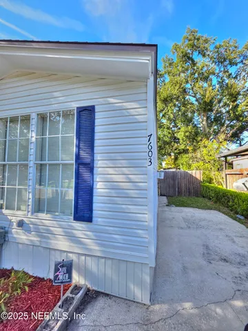 a view of livingroom with furniture and window