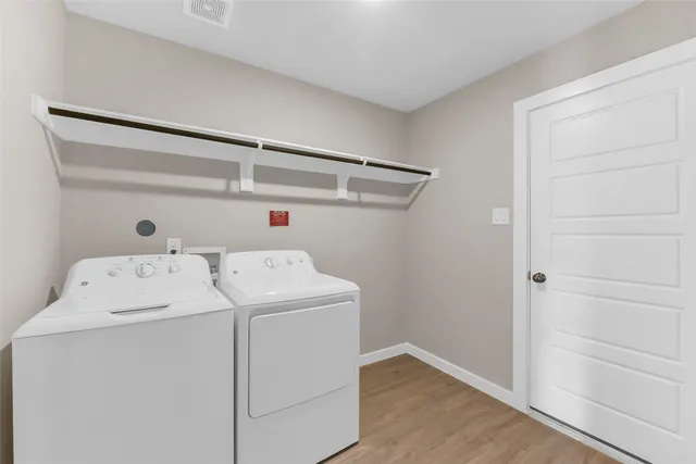 a utility room with dryer and washer