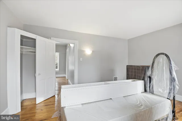 a large white bed in a white room