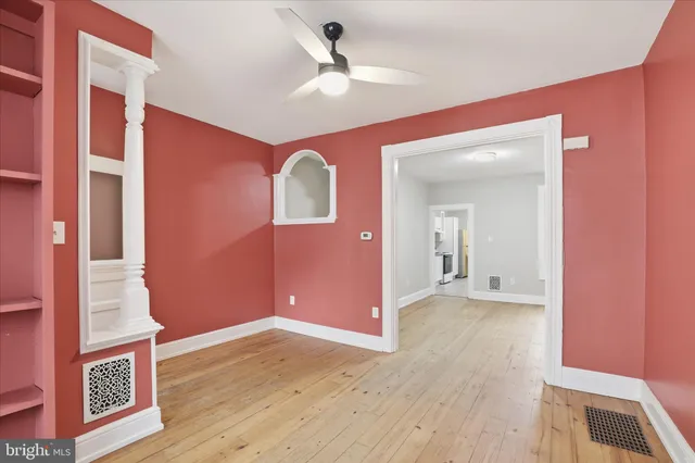 a view of livingroom with hardwood floor and a ceiling fan
