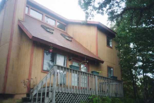 1407 Sage Road Long Pond, PA 18334 - Photo 1 of 1 a view of a house with brick walls and deck