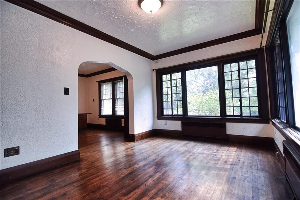 3765 Highway 257 Seneca, PA 16346 - Photo 2 of 42 an empty room with wooden floor and windows
