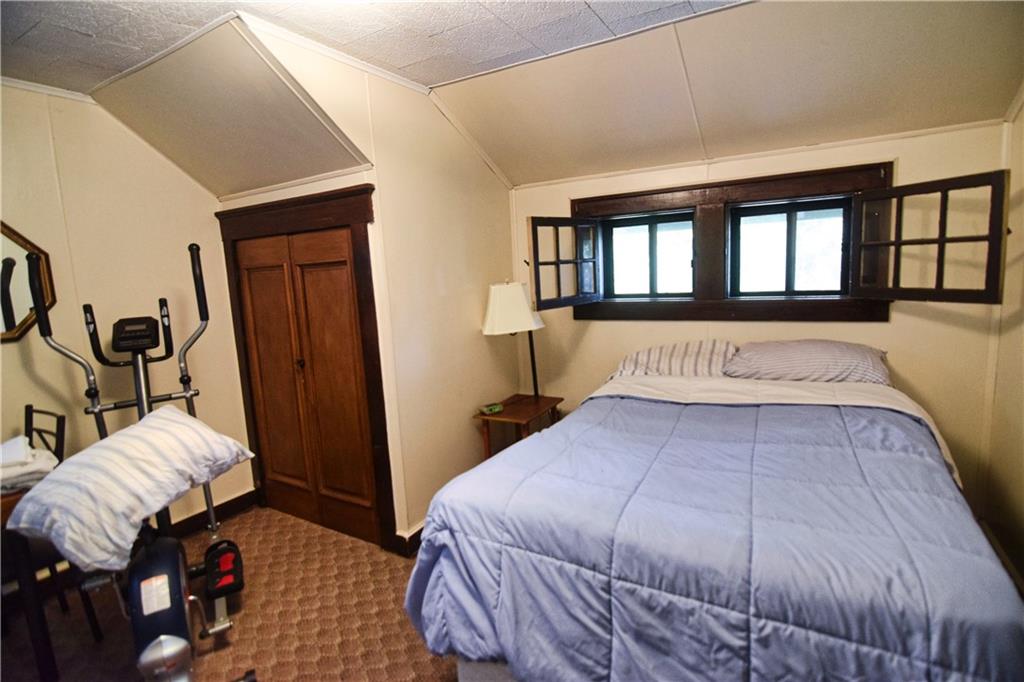 3765 Highway 257 Seneca, PA 16346 - Photo 34 of 42 a bedroom with a bed and wooden floor