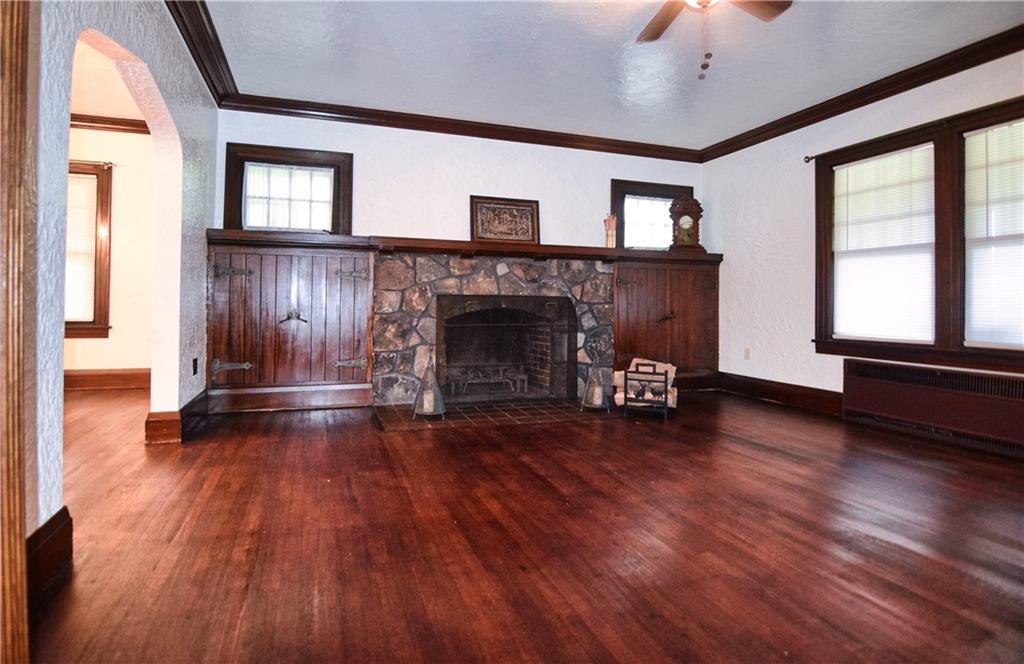 3765 Highway 257 Seneca, PA 16346 - Photo 9 of 42 a view of empty room with wooden floor and fireplace