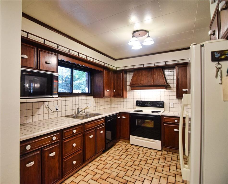 3765 Highway 257 Seneca, PA 16346 - Photo 10 of 42 a kitchen with a sink and stainless steel appliances