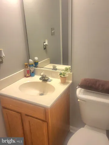 a bathroom with a granite countertop tub and a sink