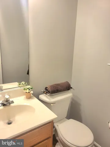 a view of an empty room with a ceiling fan