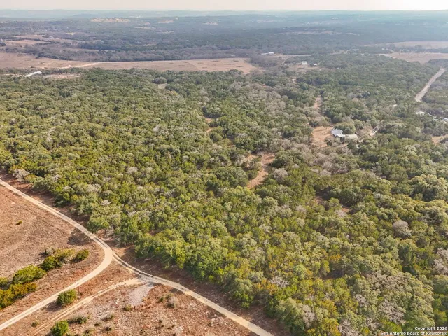 a view of a field with an outdoor space