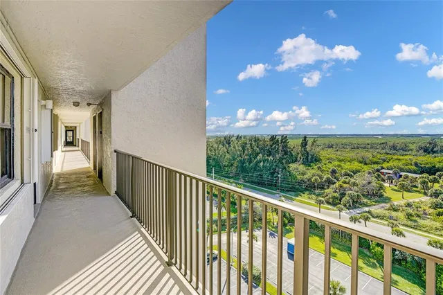 a kitchen with white cabinets stainless steel appliances and sink