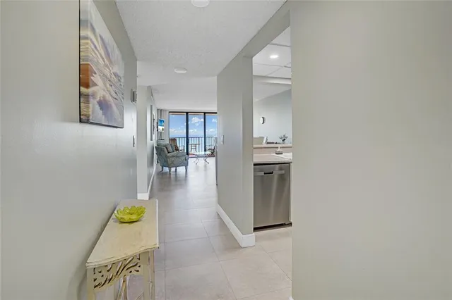 a view of a livingroom with furniture and a large window