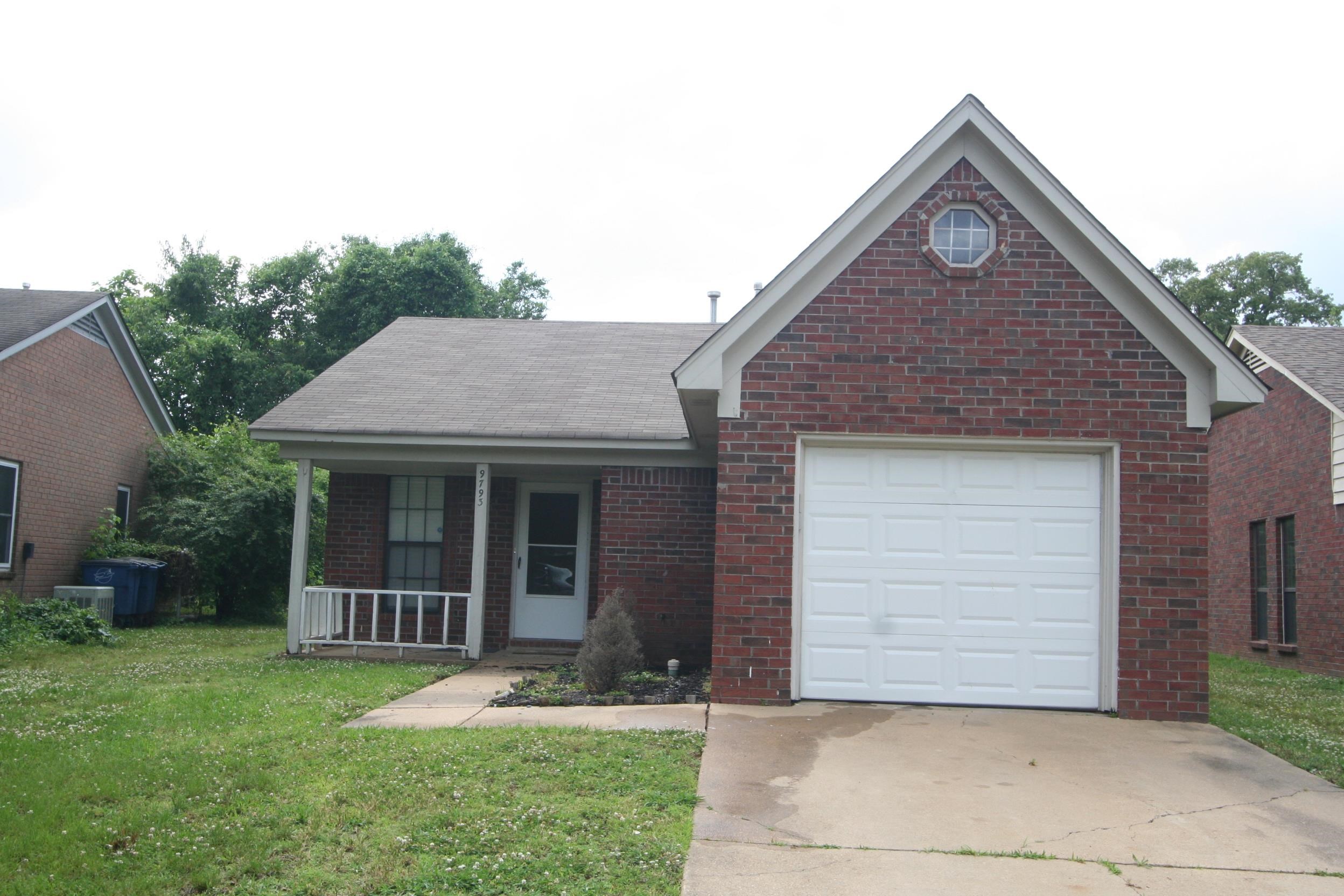 9793 Riggan Drive Olive Branch, MS 38654 - Photo 1 of 7 a front view of a house with garden