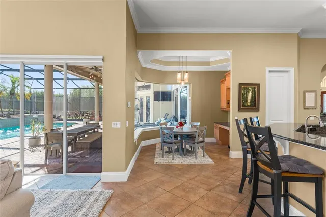 a view of a patio with a table chairs and a backyard