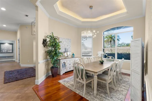 a living room with furniture and large windows