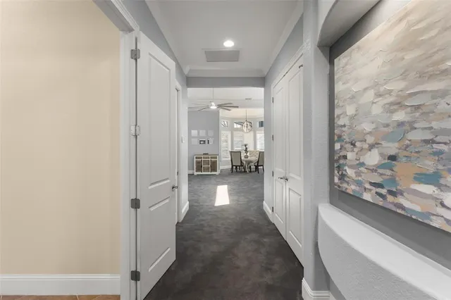 a view of a livingroom with furniture and a ceiling fan
